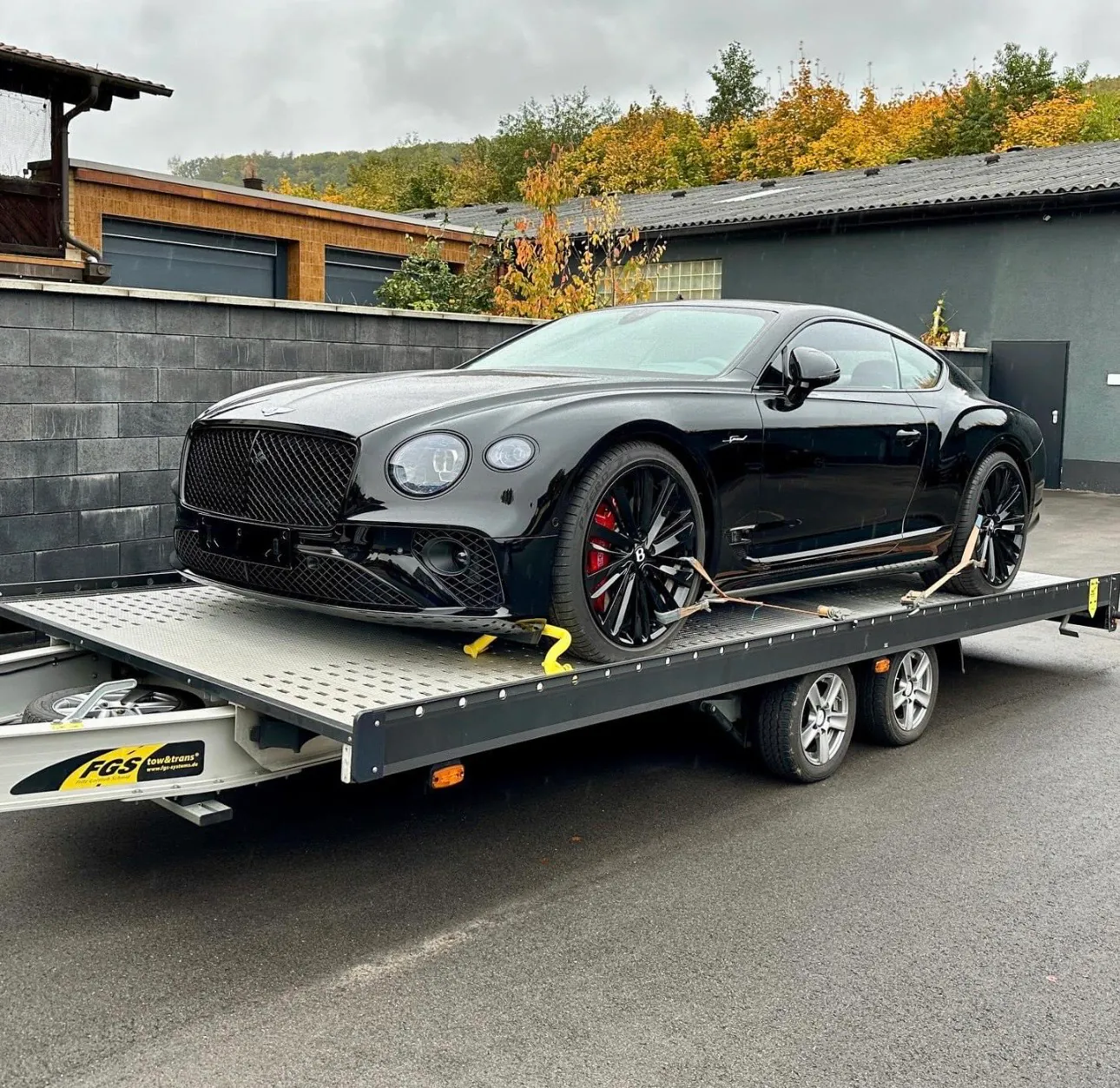 Bentley Continental GT secured on a transport trailer